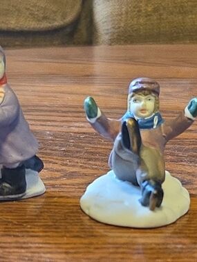Set of 3 Painted Porcelean Winter Children Sledding Figurines 2 in Tall